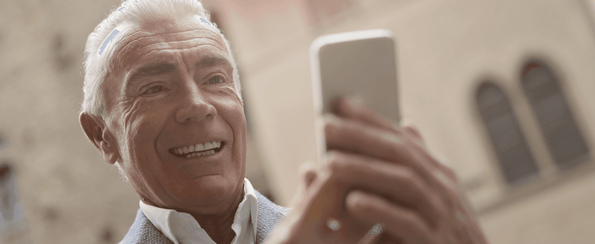 old man using the phone